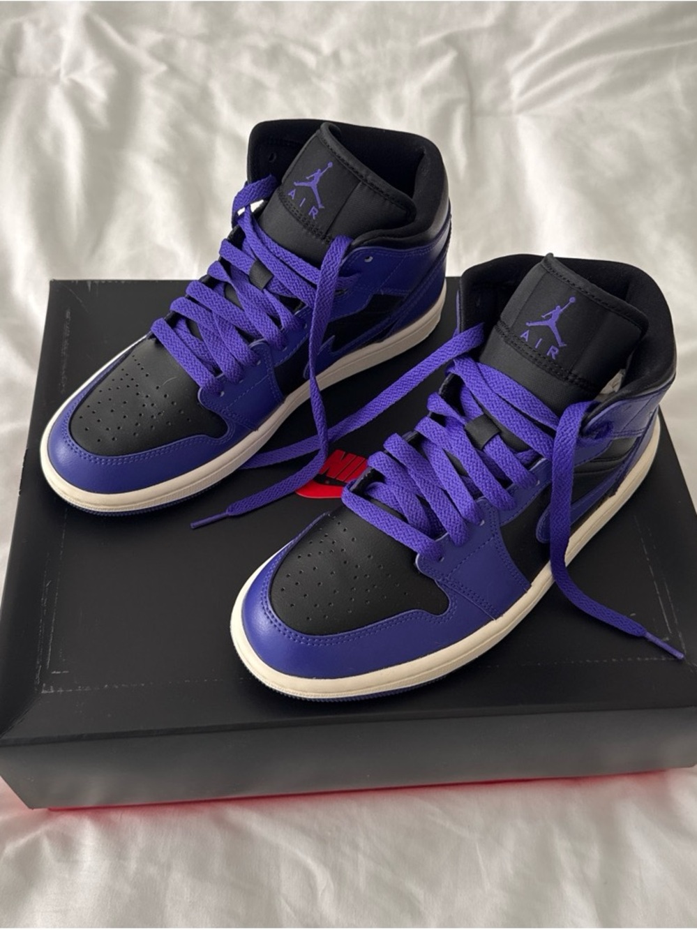 Women’s Nike Air Jordan 1 Mid in Black and Purple